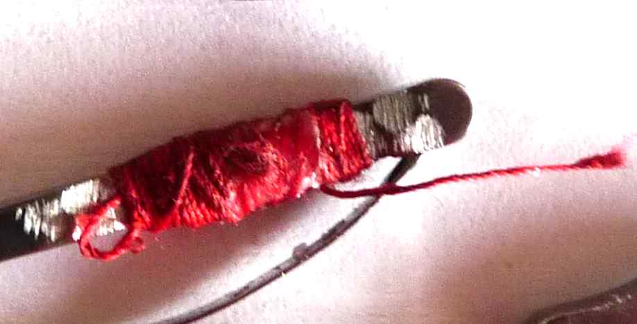 One meter red thread coil