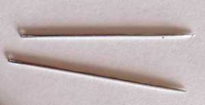 Two sewing needles